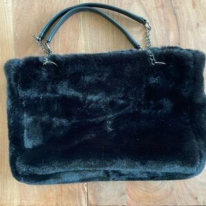 Big black furry bag